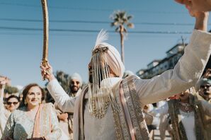 Sikh Groom in Sehra Leading His Family and Friends into Wedding During Baraat