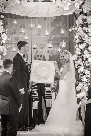 Bride and Groom Holding the Ketubah During Jewish Ceremony