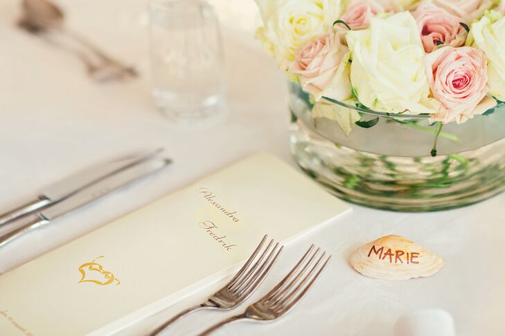 The couple used seashells for place cards, inspired by their proximity to the ocean.