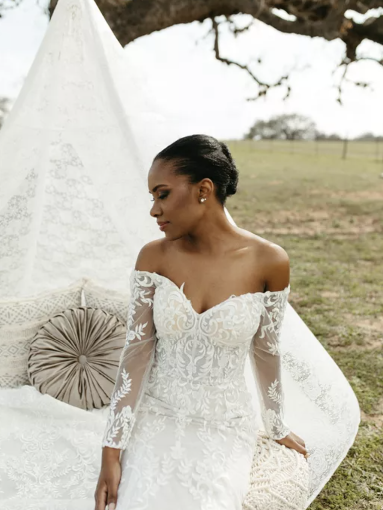 bride with slicked back updo and dark eye