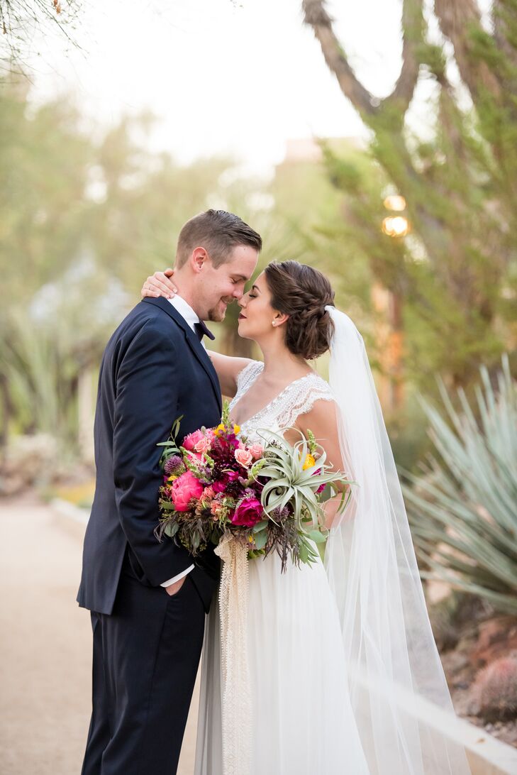 Jenna's hair and gown fit the naturally beautiful, flower-rich setting. "My dress had beautiful beaded detailing at the top, with delicate lace sleeves, a low back and a cathedral-length veil," Jenna says.