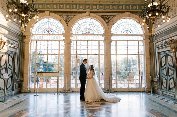 Groom in Black Tuxedo and Bride in Romantic A-Line Gown Embrace in Formal, Ornate Estate Ballroom at Vizcaya