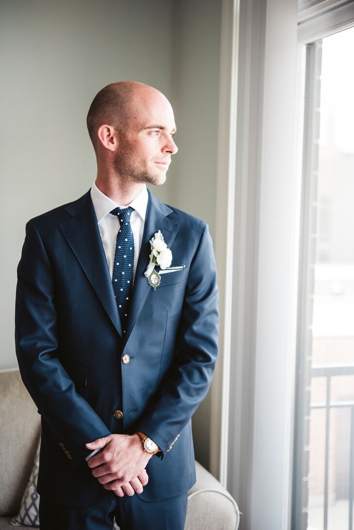 Matt's navy suit was custom-made at Formally Modern—and, in memory of his father, who had recently passed away—had “Son of Jack” embroidered into the lining of his jacket. Another way he honored his dad was by wearing a small photo of him in a pendant under his boutonniere. “That way, his father would be close to his heart during the wedding,” Lydia says.