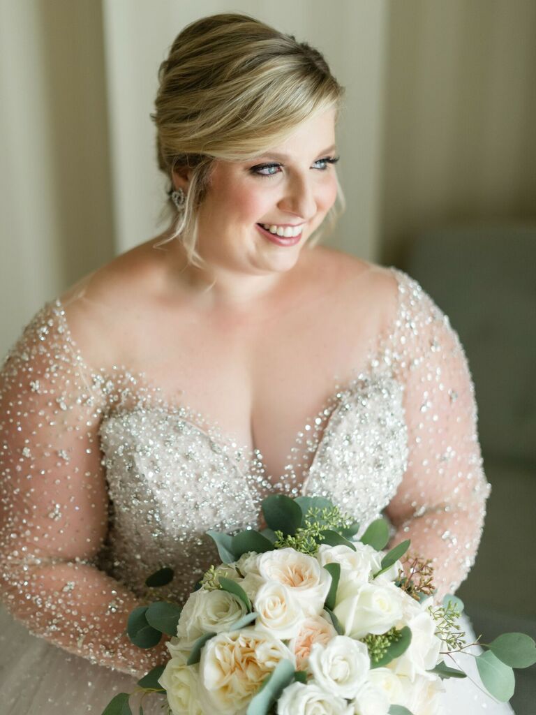 bride wearing wedding dress with illusion neckline