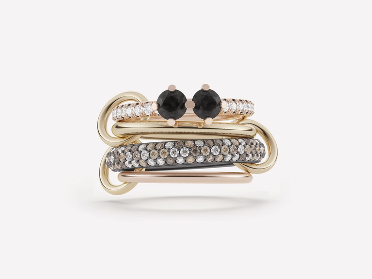 This Spinelli Kilcollin engagement ring is all about the bling, with multiple bands and white and black diamonds.