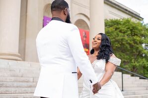 Groom in White Tuxedo Jacket Holding Hands With Bride in Off-the-Shoulder Gown, First Look