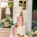 Four-Tier Wedding Cake With Panels in Shades of Pink, Designs and Fresh Flowers