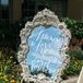 Several framed mirrors were placed around the ceremony entrance and the reception, each was decorated with calligraphed phrases such as "I promise to love you every day of forever."