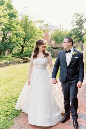 Bride in Classic, A-Line Dress With 3D Floral Details and Groom in Classic Dark Tuxedo