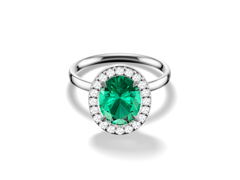 oval halo engagement ring with a bright Emerald green center stone