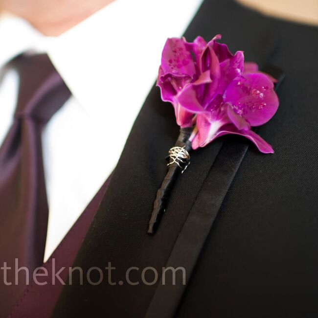 All the groomsmen wore magenta orchids on their lapels.