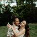 Couple Hugging and Smiling With Champagne Flutes