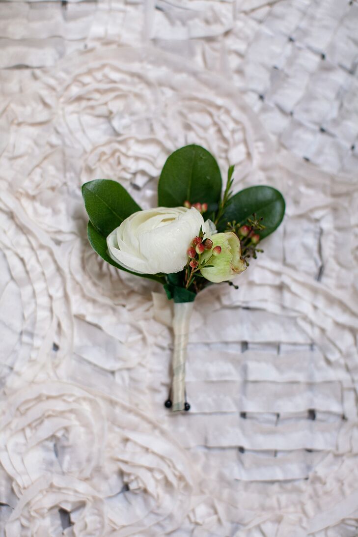 Fresh white peonies surrounded by greenery create this classic boutonniere. They contrasted beautifully against the sharp blue suits worn by Tanner and his groomsmen.