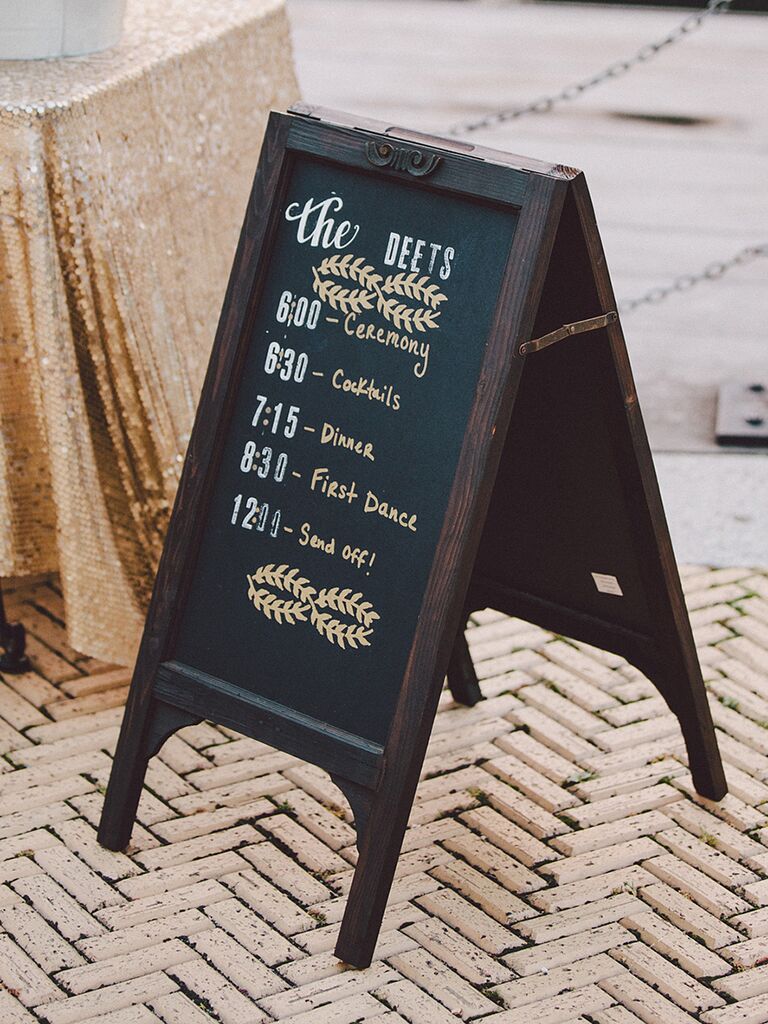Wedding chalkboard sign with the ceremony and reception schedule