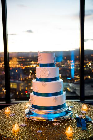 Blue and White Snowflake-Adorned Wedding Cake