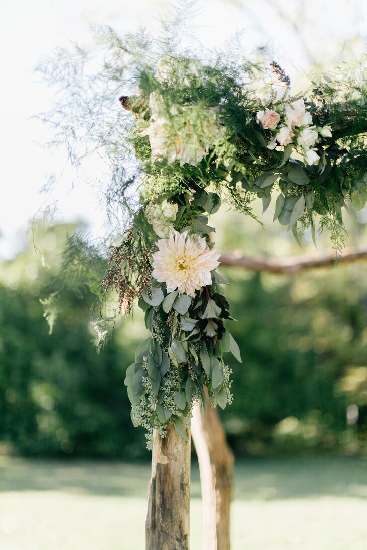 The birchwood arch under which the couple were married was adorned with eucalyptus, rose, dahlia and greenery, inspired by Heather's experience in Amsterdam, the Netherlands, where she lived for two years. "Floral arrangements in the Netherlands are often very textured and I wanted to bring that aesthetic to the wedding," she says.