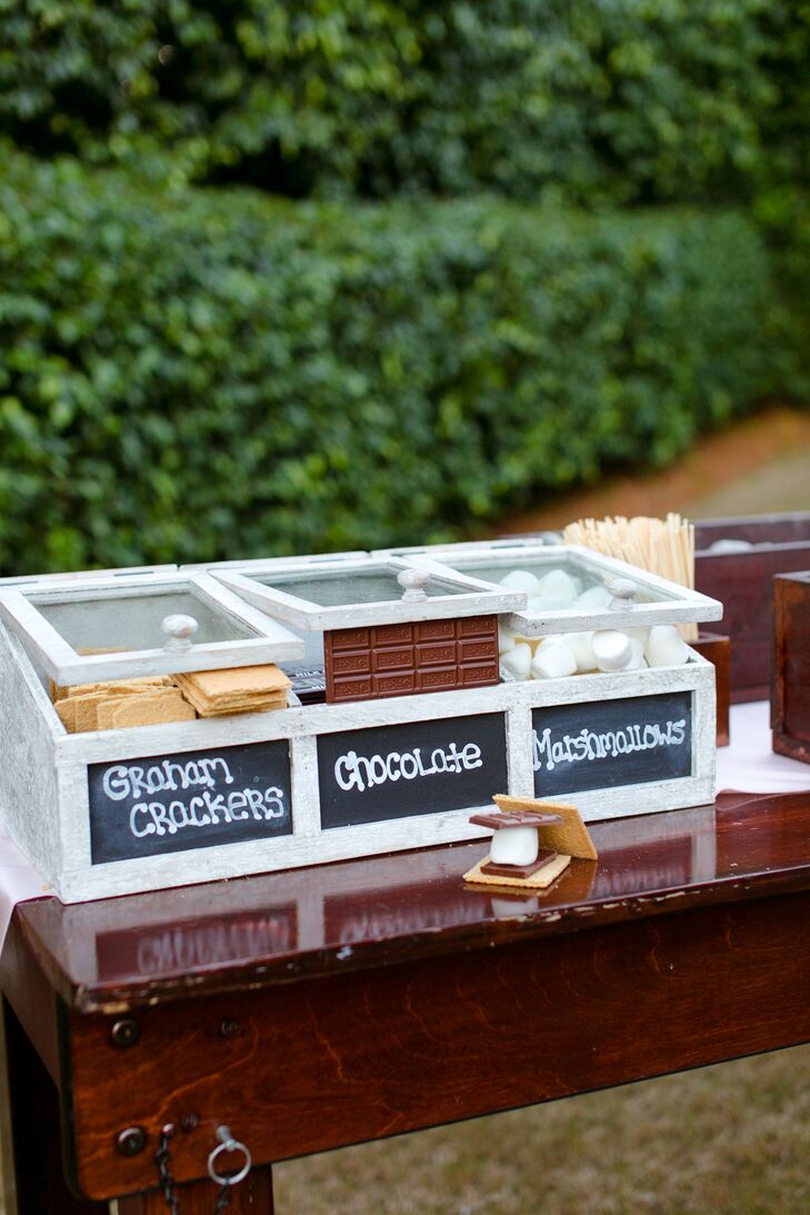 There were multiple stations set up throughout the reception including a candy bar, a gift table for guests with flip-flops and a s’mores bar that looked almost too good to eat. The marshmallows, chocolate and graham crackers were all separated into different compartments in this cute white cabinet so guests could quickly grab ingredients and enjoy their treats.