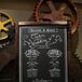 We had my brother Chris do the chalkboard art for our Program, says Danielle. We didn’t want to hand out a formal program, since we knew that they would just be left behind--instead Mike built a large chalkboard and framed it and we had it at the entrance of the wedding. We LOVED IT and still trying to figure out how we can display it in our house.