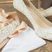 Jennifer paired her lace gown with lace wedge heels from Sole Society and a beaded sash from Etsy.