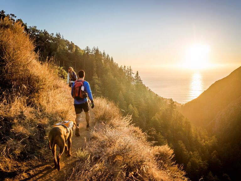 Couple with dog hike in Big Sur