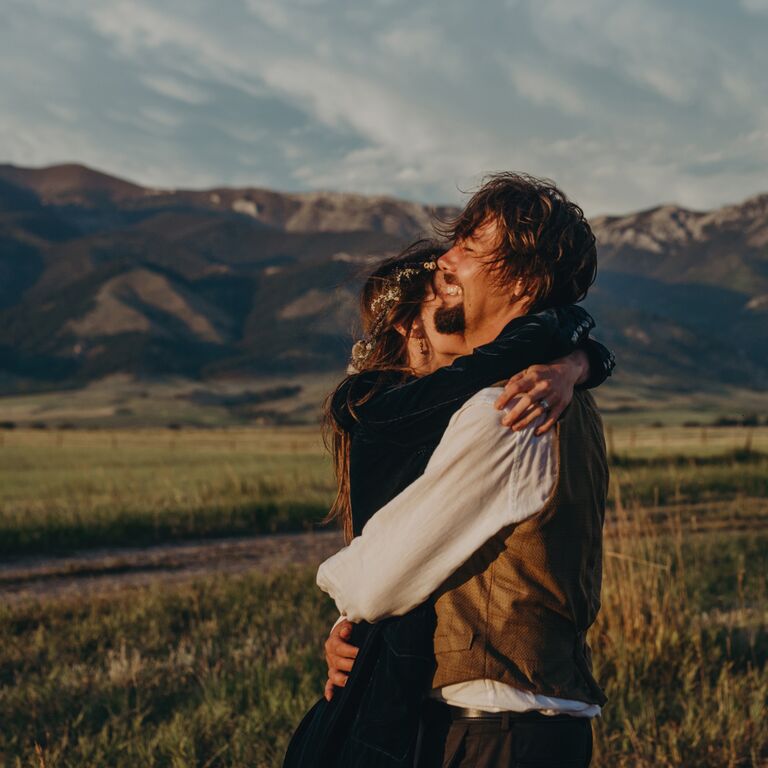 Windy engagement photo idea in the mountains