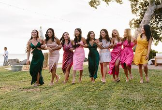 Guests wearing dresses at summer wedding