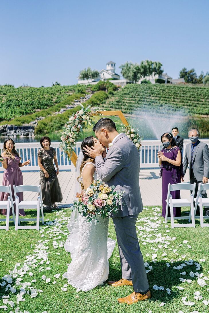 Couple Sharing Kiss During Wedding at Leal Vineyards in Hollister,  California