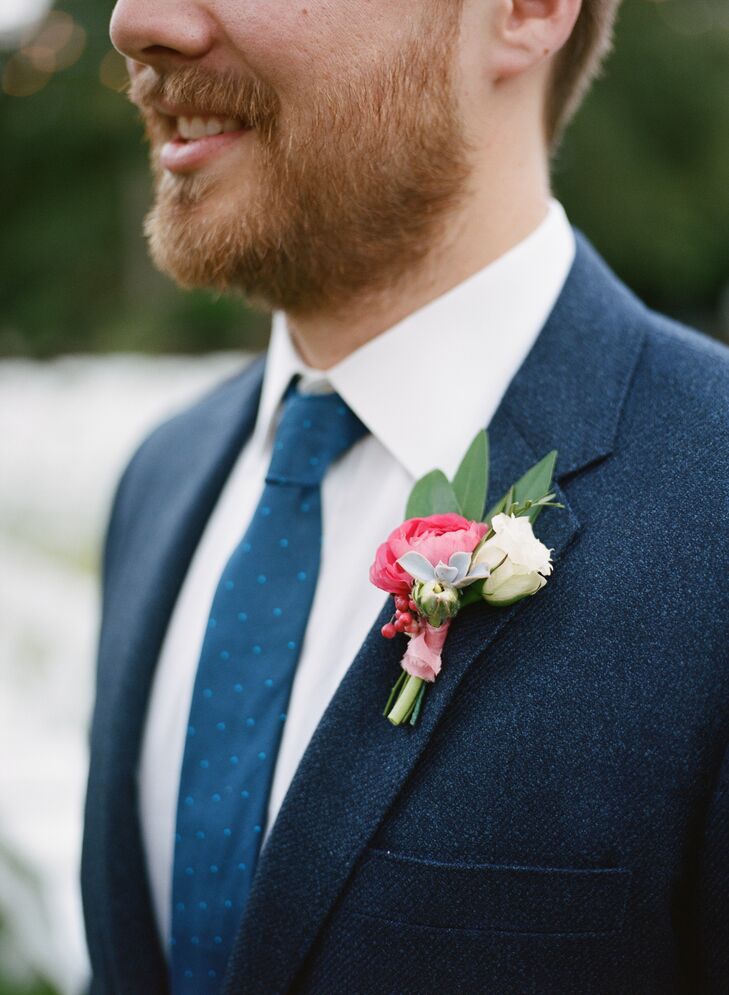 Ian and his groomsmen embellished their suits with pink ranunculus blossoms and greenery.