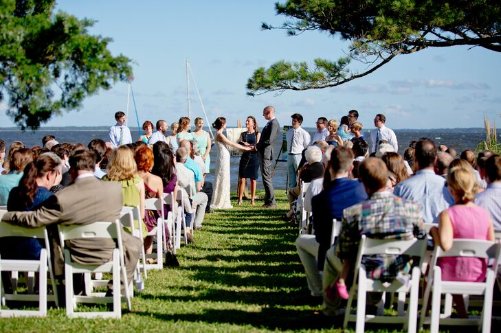 The first time Shelly stayed at the Stallings, she fell in love with it's rustic, sea inspired decor. They decided to get married on the lawn, with the boats Ben grew up sailing anchored behind them, and paintings by Shelly's mom on easels framing them.