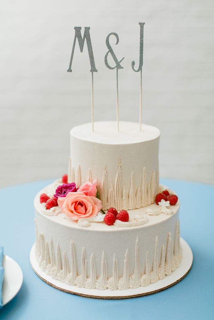 Because the couple served other desserts, the chocolate, raspberry and hazelnut two-tier cake was deliberately kept small and simple. Mary made the cake topper using the couple’s initials.