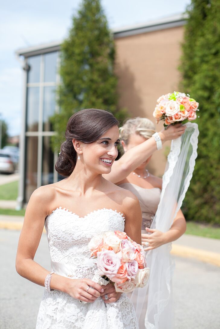 Jennifer carried a bouquet with ivory, blush, pink and peach roses. Her bridesmaids carried similar bouquets that included baby's breath.