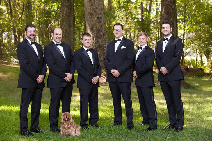 The groomsmen wore traditional black tuxedos with black bow ties.