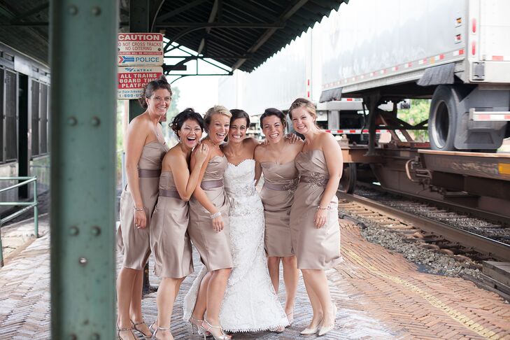The bridesmaids wore knee length, strapless satin dresses in champagne.
