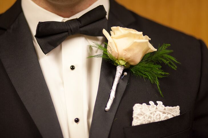 Jonathan wore an ivory rose boutonniere as well as a lace pocket square to distinguish himself from the groomsmen.