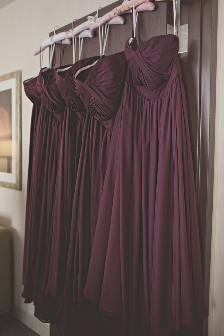 The bridesmaids wore convertible, burgundy chiffon dresses. I picked this particular dress because it was a flattering choice for every figure, age and style, says Emily.