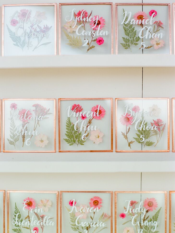 "To incorporate our floral theme, we made individually pressed flower coasters with our guests’ names and table numbers as escort cards, which doubled as favors," Deborah says.