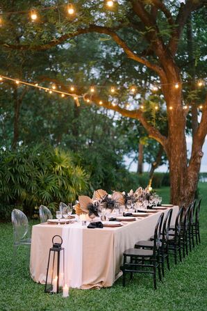 Wedding Tablescape With Beige Linen Under String Lights