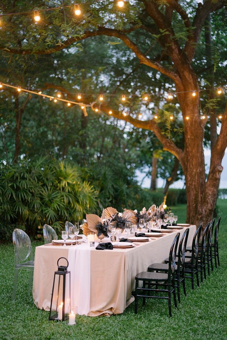Wedding Tablescape With Beige Linen Under String Lights