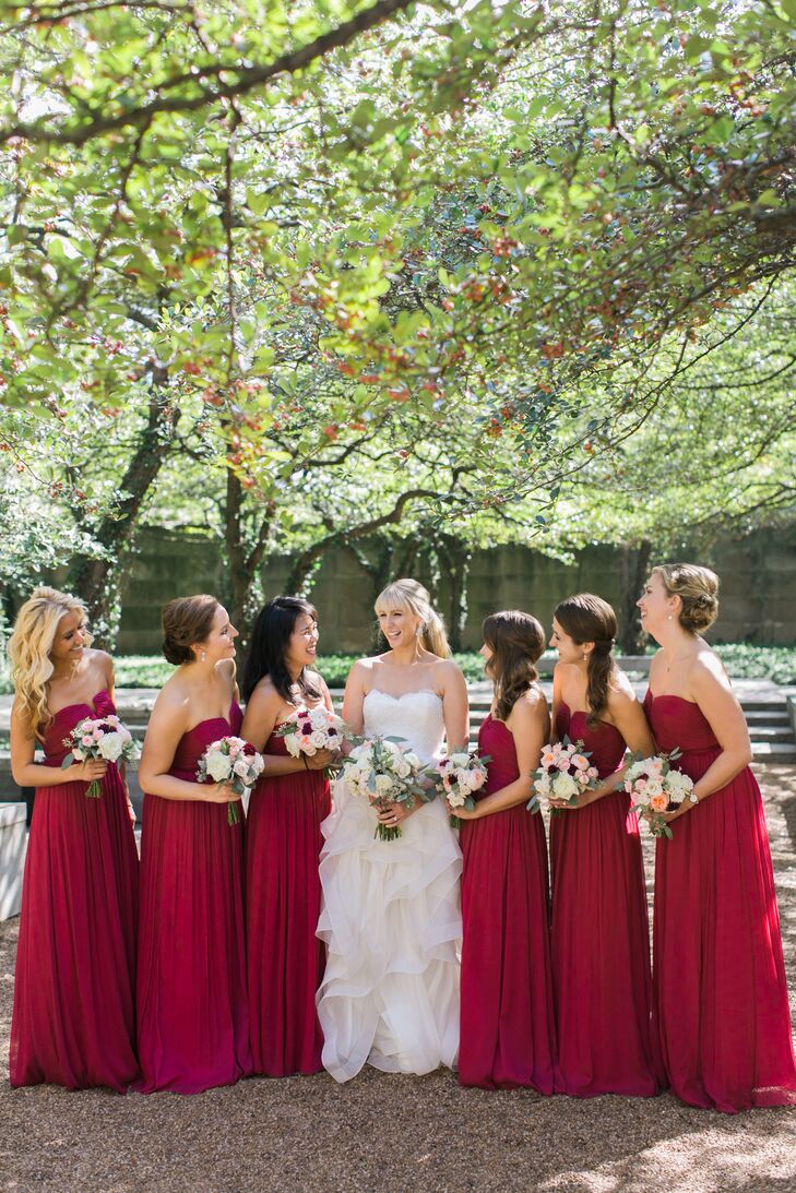 The bridesmaids wore raspberry red full length gowns from J. Crew. "We thought they added a pop of color to the venue," Jessica says.