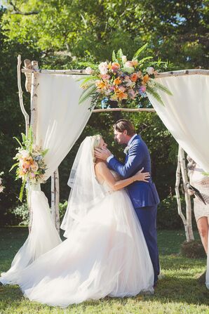 Birch Wedding Arch With Textured Floral Arrangements