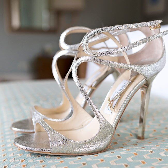 The bride wore strappy silver heels down the aisle on her wedding day.