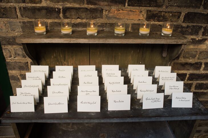 James and Stephen arranged the traditional escort cards on a table with a line of votive candles.