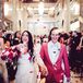 Brides Walking Up Aisle While Guests Throw Rose Petals, Pink Flowers and Suit