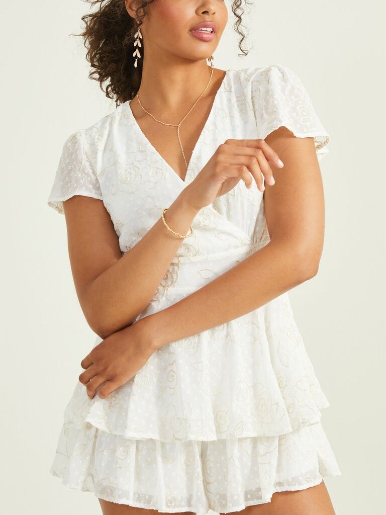 A layered tie-waist white romper with short sleeves from Altar'd State