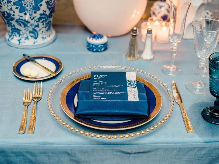 navy blue and gold place setting