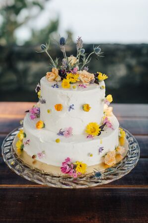 Tiered Cake Covered with Yellow Wildflowers