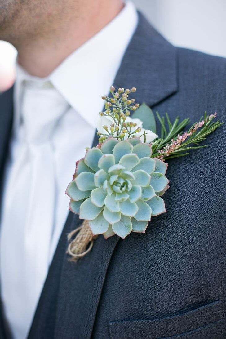 The groom and groomsmen wore succulents with seeded eucalyptus for their rustic boutonnieres.