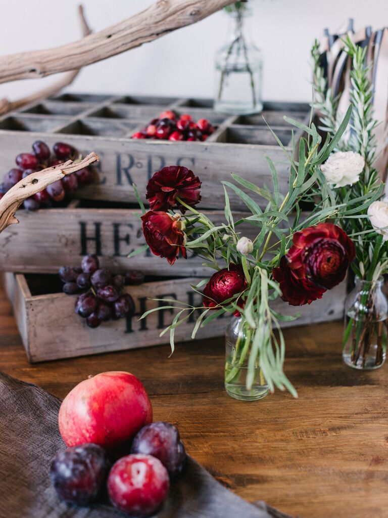 Plum red grape pomegranate wine-toned wedding floral arrangements