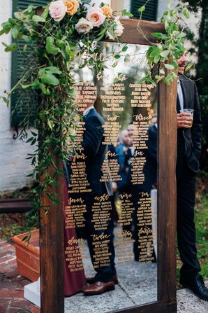 Rustic-Boho Seating Chart Written on Wood-Framed Mirror with Roses and Greenery
