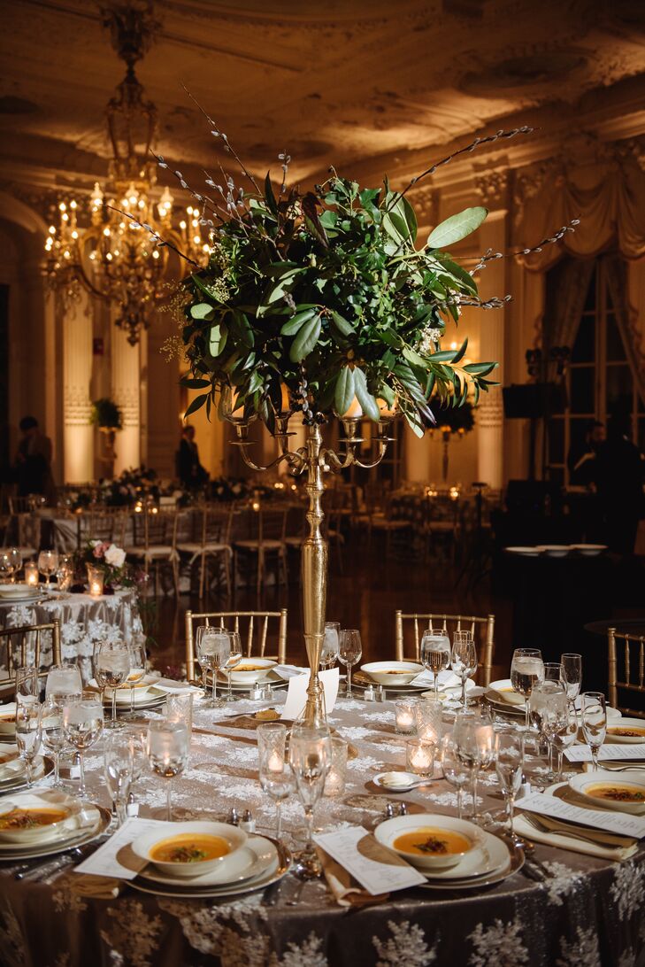 Tall Mixed-Greenery Centerpieces on Gold Candelabras